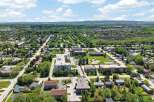 Discover this charming suburban neighborhood featuring a mix of single-family homes and apartment buildings, perfect for families and professionals alike.