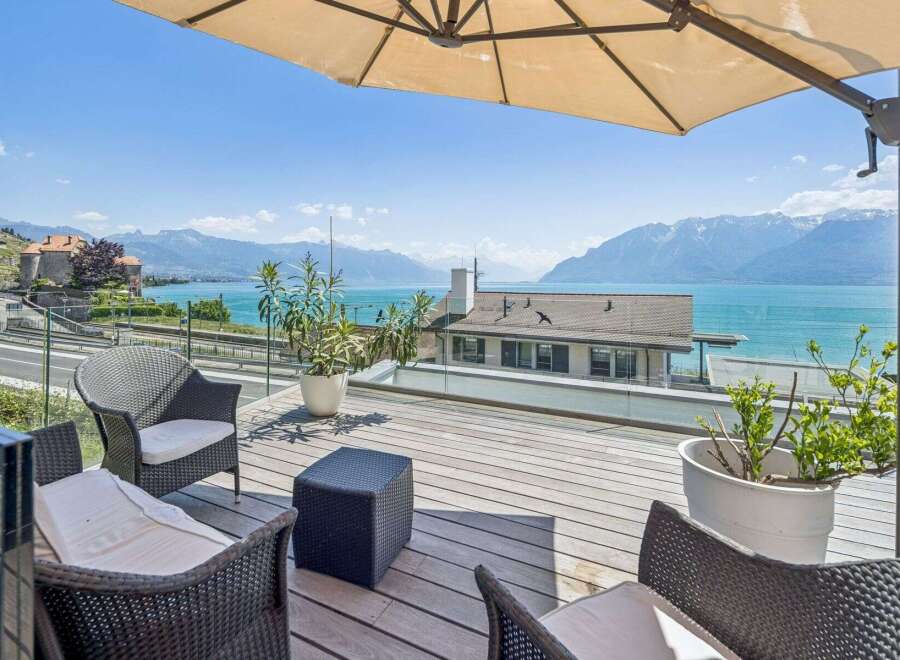Experience breathtaking lake and mountain views from this stunning terrace, perfect for al fresco dining or relaxing with a book.