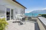 Enjoy breathtaking lake and mountain views from this stunning balcony, perfect for al fresco dining or morning coffee.