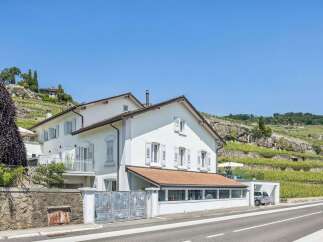 Discover this stunning property nestled against a picturesque hillside vineyard, offering breathtaking views and a serene atmosphere.
