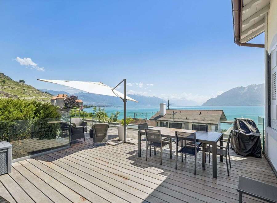Enjoy breathtaking lake and mountain views from this stunning outdoor living space.