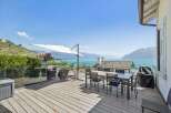 Enjoy breathtaking lake and mountain views from this stunning outdoor living space.