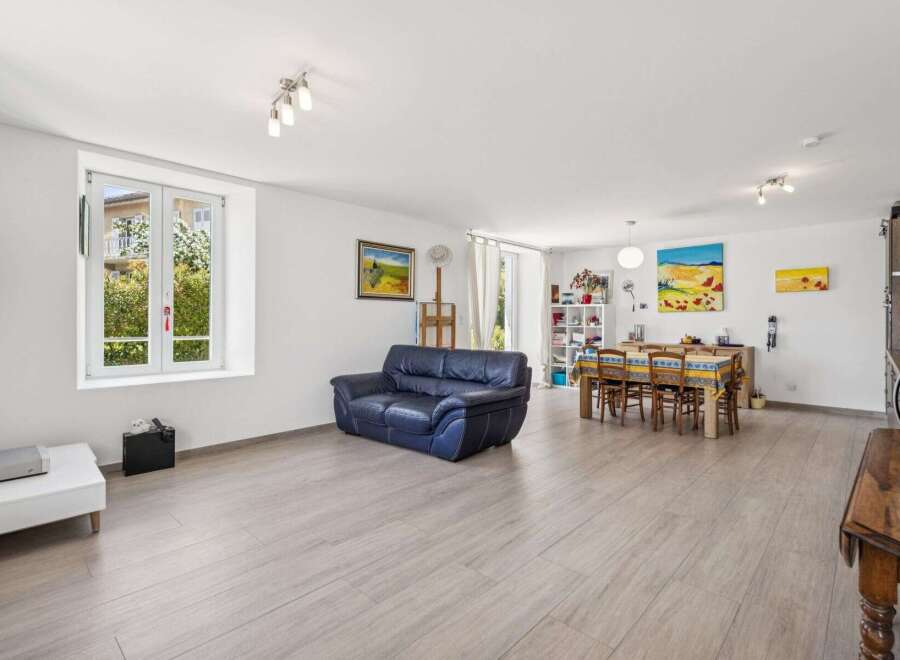 Discover this spacious open-concept living and dining area, perfect for entertaining.