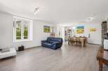 Discover this spacious open-concept living and dining area, perfect for entertaining.