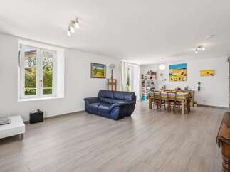 Discover this spacious open-concept living and dining area, perfect for entertaining.