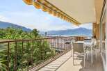 Enjoy breathtaking panoramic views of the lake and mountains from this stunning balcony.