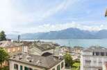 Experience breathtaking panoramic views of the serene lake and majestic mountains from this exceptional property.