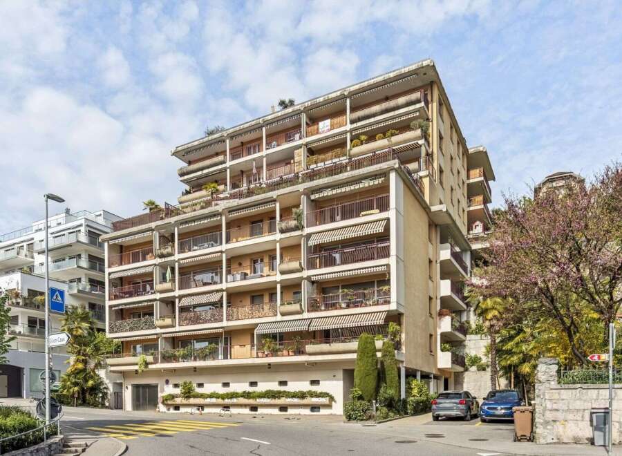 Discover this stunning apartment building featuring multiple balconies with awnings, offering ample outdoor space and protection from the sun.
