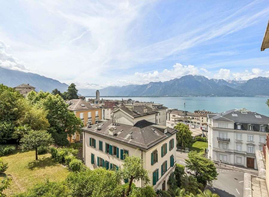 Experience breathtaking panoramic views of the serene lake and majestic mountains from this exquisite property.