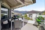 Enjoy breathtaking mountain views from this charming balcony, perfect for outdoor dining and relaxation.