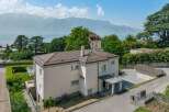 Discover this charming property offering breathtaking panoramic views of a serene lake and majestic mountains.
