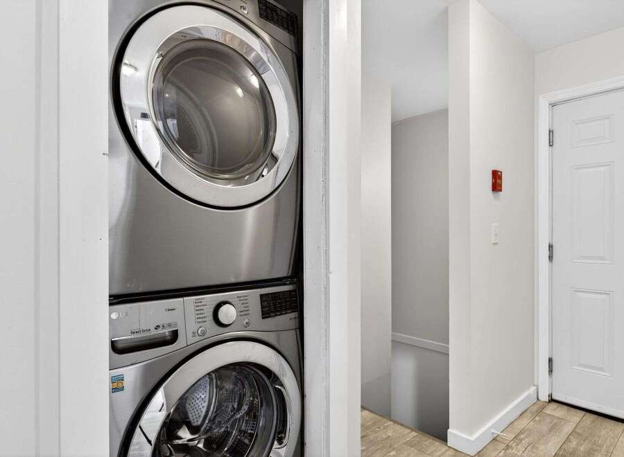 Discover convenience with this stacked LG washer and dryer set, perfect for maximizing space in your laundry area.