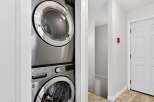Discover convenience with this stacked LG washer and dryer set, perfect for maximizing space in your laundry area.