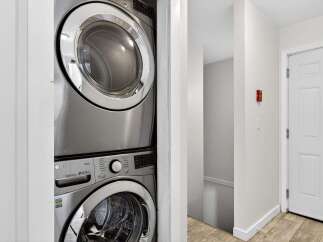 Discover convenience with this stacked LG washer and dryer set, perfect for maximizing space in your laundry area.