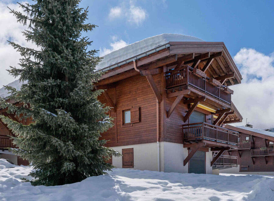 Experience the charm of a winter wonderland in this stunning wooden chalet, nestled amidst snow-covered landscapes.