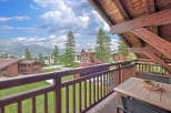 Enjoy breathtaking mountain views from this charming chalet balcony, perfect for morning coffee or evening relaxation.