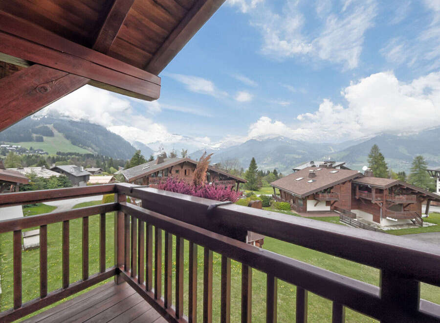 Experience breathtaking mountain views from this charming chalet-style property, perfect for a serene getaway.