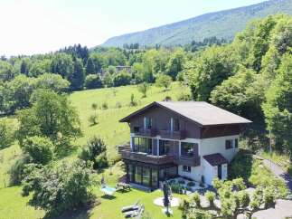 Nestled amidst lush greenery and rolling hills, this stunning property offers a serene escape with breathtaking mountain views.