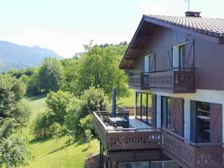 Experience breathtaking mountain views from this stunning property featuring multiple balconies and a spacious deck perfect for outdoor entertaining.