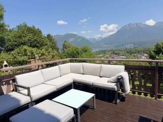 Enjoy breathtaking mountain and lake views from this stunning balcony, perfect for relaxing or entertaining.