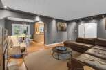 Step into this inviting living space featuring a plush brown leather sectional sofa perfect for relaxation and entertainment.