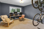 This home office features a dual-monitor setup with a long desk, perfect for productivity.
