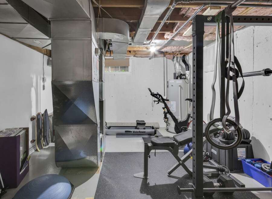 Transform your basement into a personal fitness sanctuary with this well-equipped home gym.