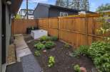 Discover this charming backyard oasis, perfect for gardening enthusiasts.