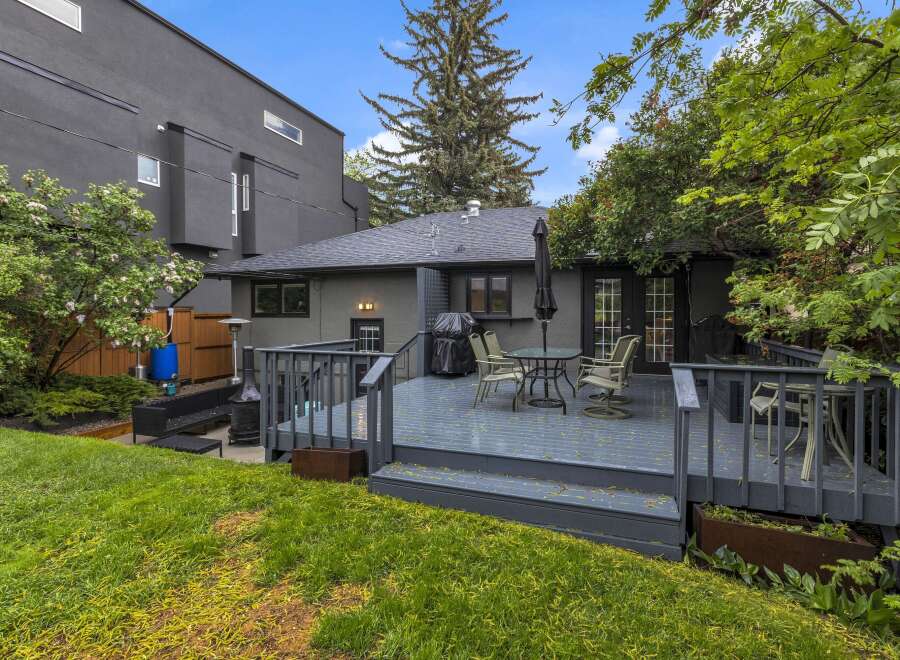Enjoy outdoor living on this spacious deck, perfect for entertaining or relaxing.