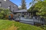 Enjoy outdoor living on this spacious deck, perfect for entertaining or relaxing.