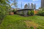 Enjoy ultimate relaxation in this backyard oasis, featuring a charming wooden hot tub perfect for unwinding.