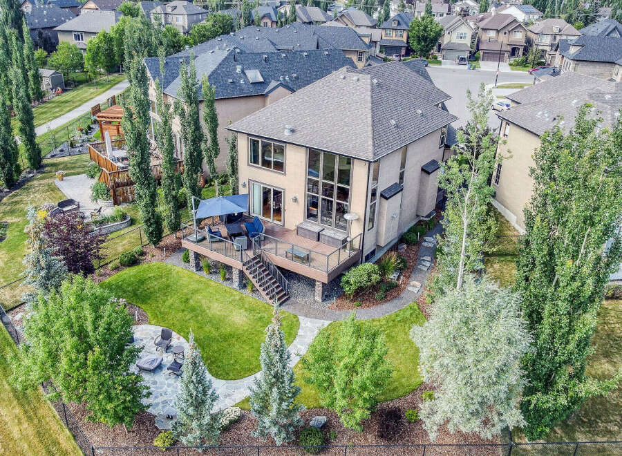 Experience luxurious outdoor living with this stunning backyard featuring a multi-level deck, perfect for entertaining guests.