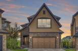 Experience luxury living in this stunning home featuring a striking stone facade and a warm, inviting stucco exterior.