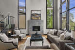 Experience luxury living in this stunning great room, featuring soaring ceilings and expansive windows that flood the space with natural light.