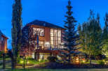 Experience luxury living in this stunning home featuring a multi-level deck perfect for entertaining and enjoying the twilight ambiance.
