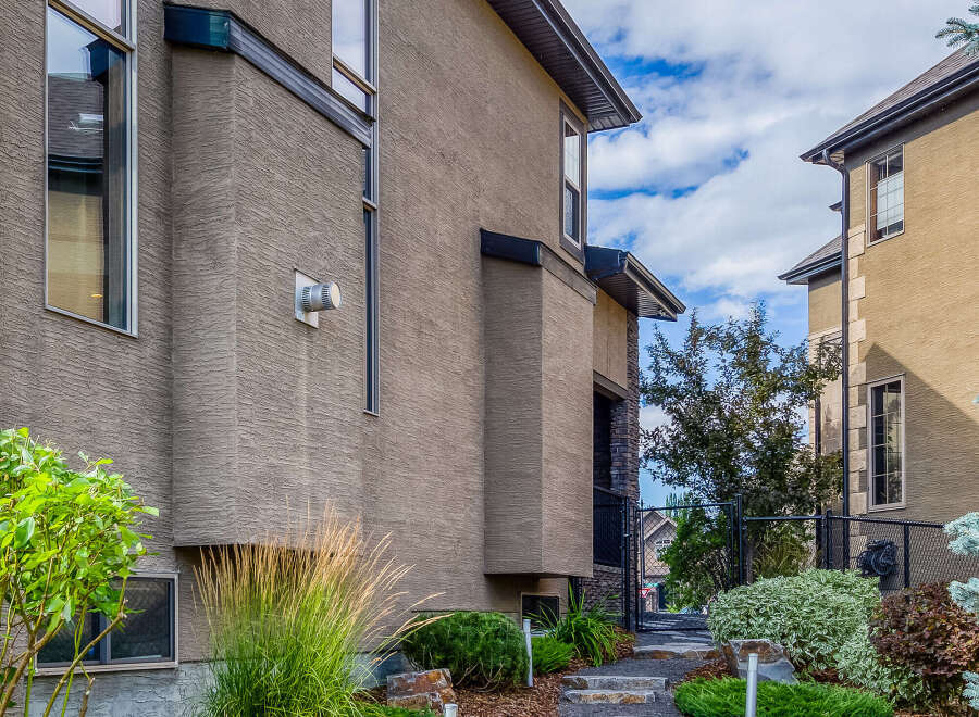 Discover this charming property featuring a beautifully landscaped pathway leading to the entrance.