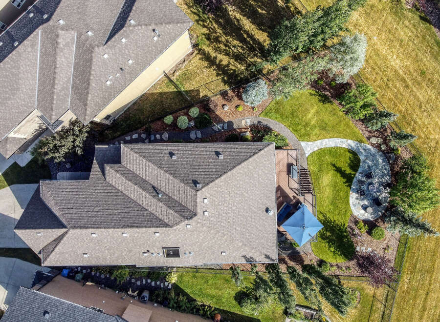 Experience luxury outdoor living with this stunning aerial view showcasing a beautifully landscaped backyard.