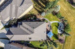 Experience luxury outdoor living with this stunning aerial view showcasing a beautifully landscaped backyard.