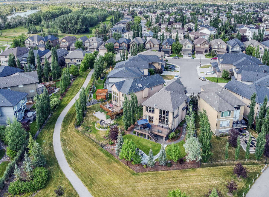 Experience luxury living in this stunning aerial view of a suburban neighborhood.