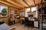 Discover this charming wooden home office, perfect for remote work or a creative studio.