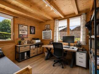 Discover this charming wooden home office, perfect for remote work or a creative studio.
