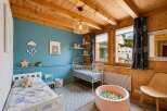 Discover this charming children's room, perfect for a family home.