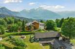 Experience luxury mountain living in this stunning chalet, boasting panoramic views of snow-capped peaks and lush valleys.