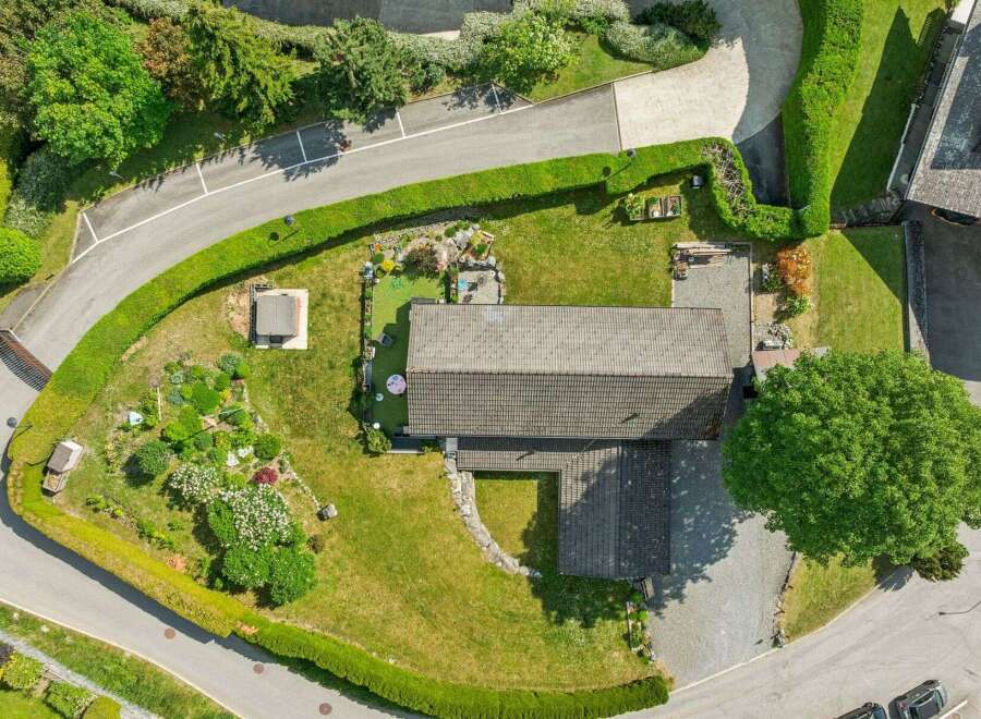 Discover this stunning property featuring a spacious, well-maintained lawn perfect for outdoor activities.