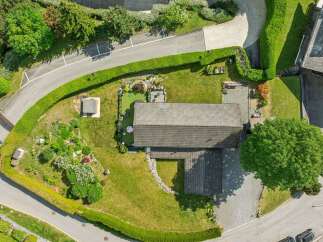 Discover this stunning property featuring a spacious, well-maintained lawn perfect for outdoor activities.