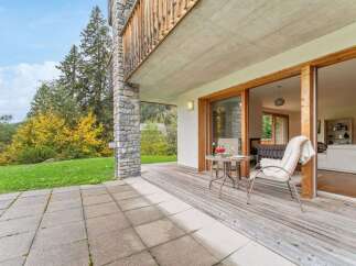 Enjoy the stunning mountain views from this spacious balcony, perfect for outdoor dining or relaxing with a book.