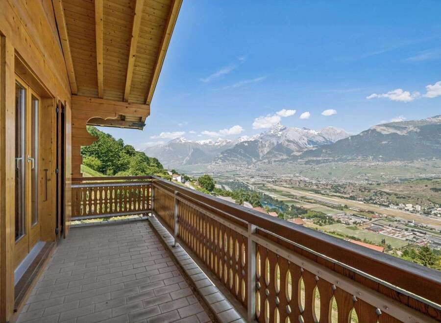 Experience breathtaking panoramic views from this stunning balcony, perfect for enjoying your morning coffee or evening sunset.