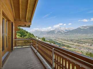Experience breathtaking panoramic views from this stunning balcony, perfect for enjoying your morning coffee or evening sunset.