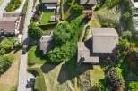 Discover this charming property featuring a well-maintained lawn and lush greenery, perfect for outdoor enjoyment.