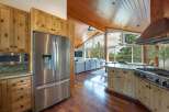 Experience breathtaking mountain views from this stunning open-concept living space, featuring a gourmet kitchen with a professional-grade Viking range and ample custom cabinetry.